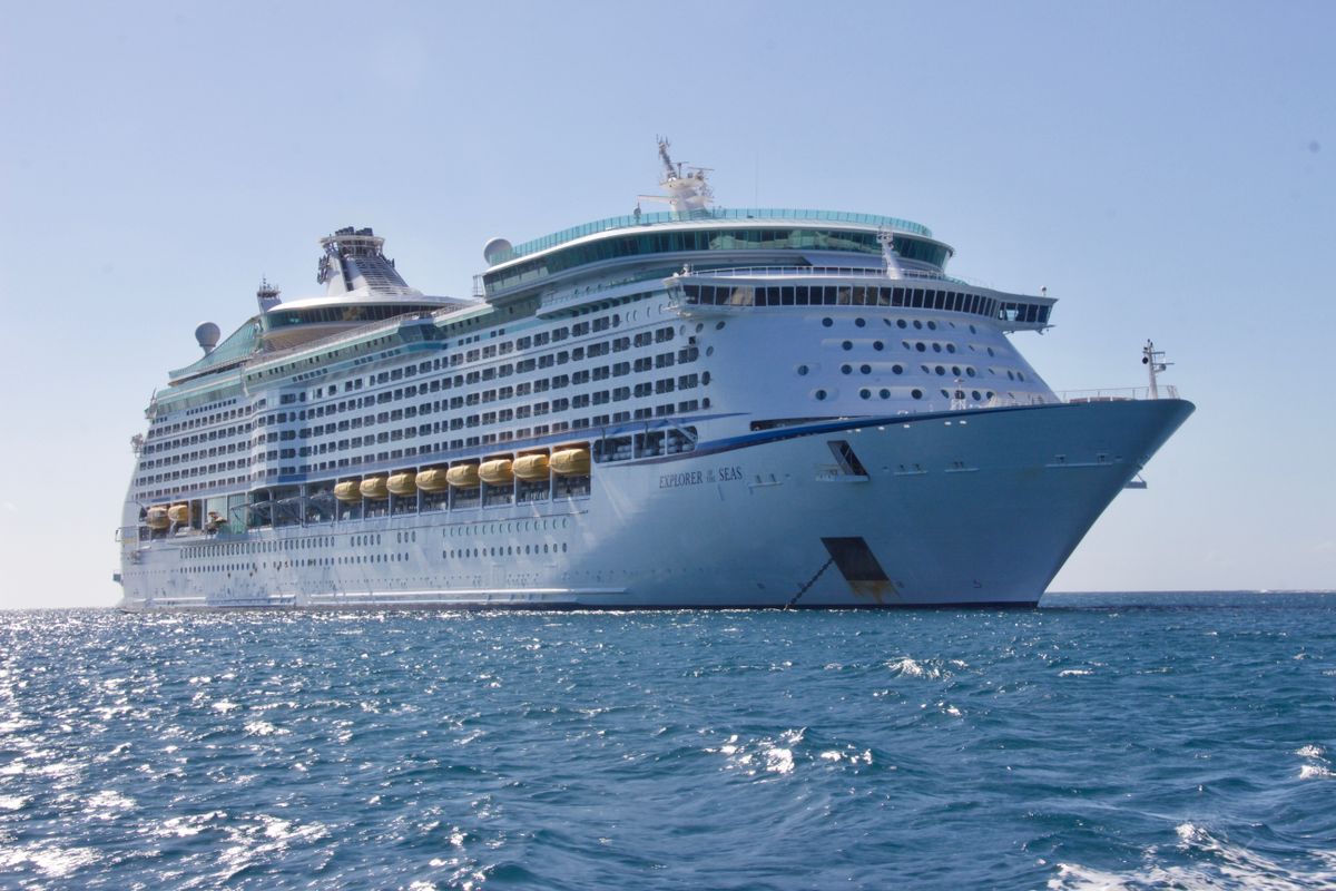 White cruise ship sailing on the ocean