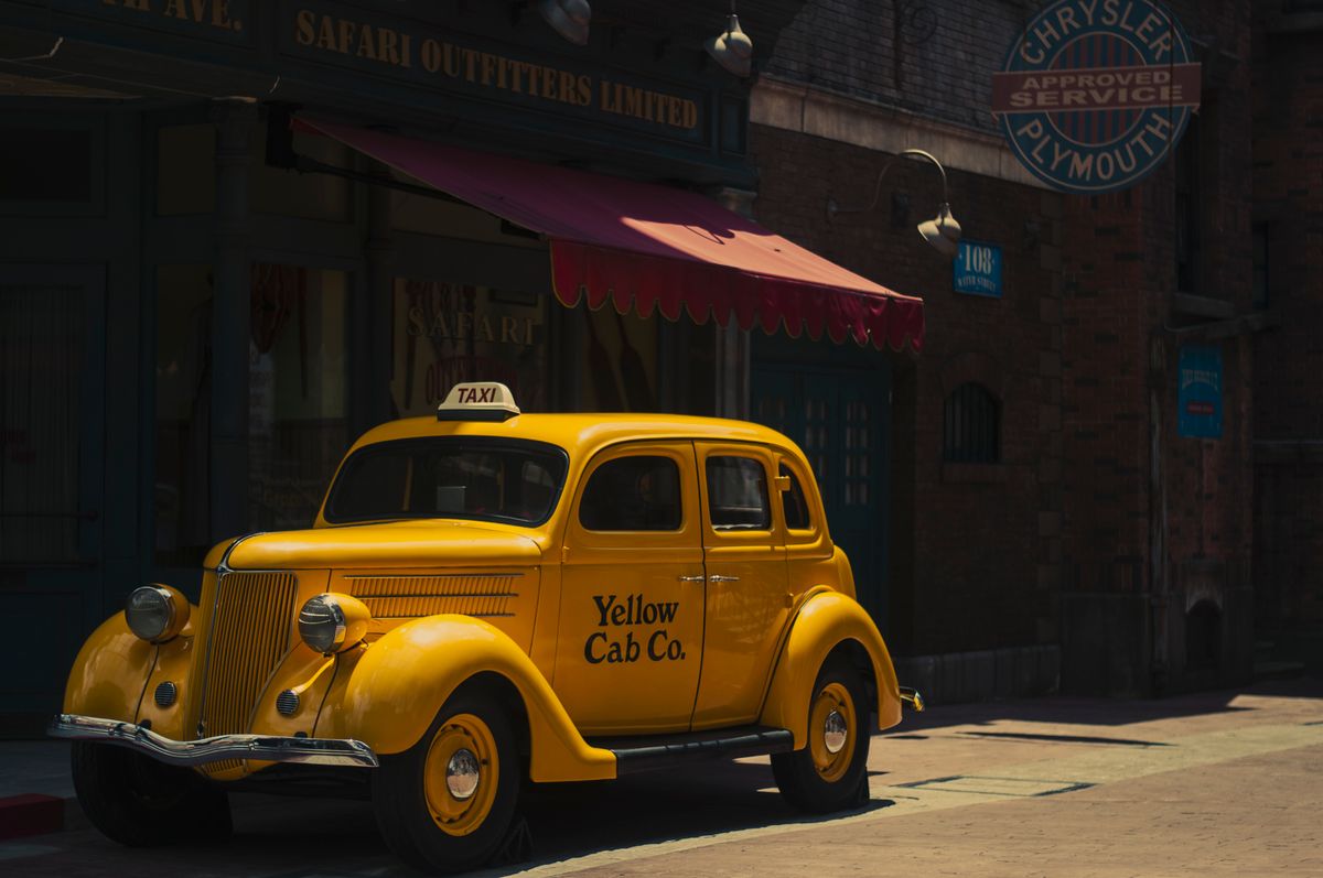 Yellow taxi cab on a city street